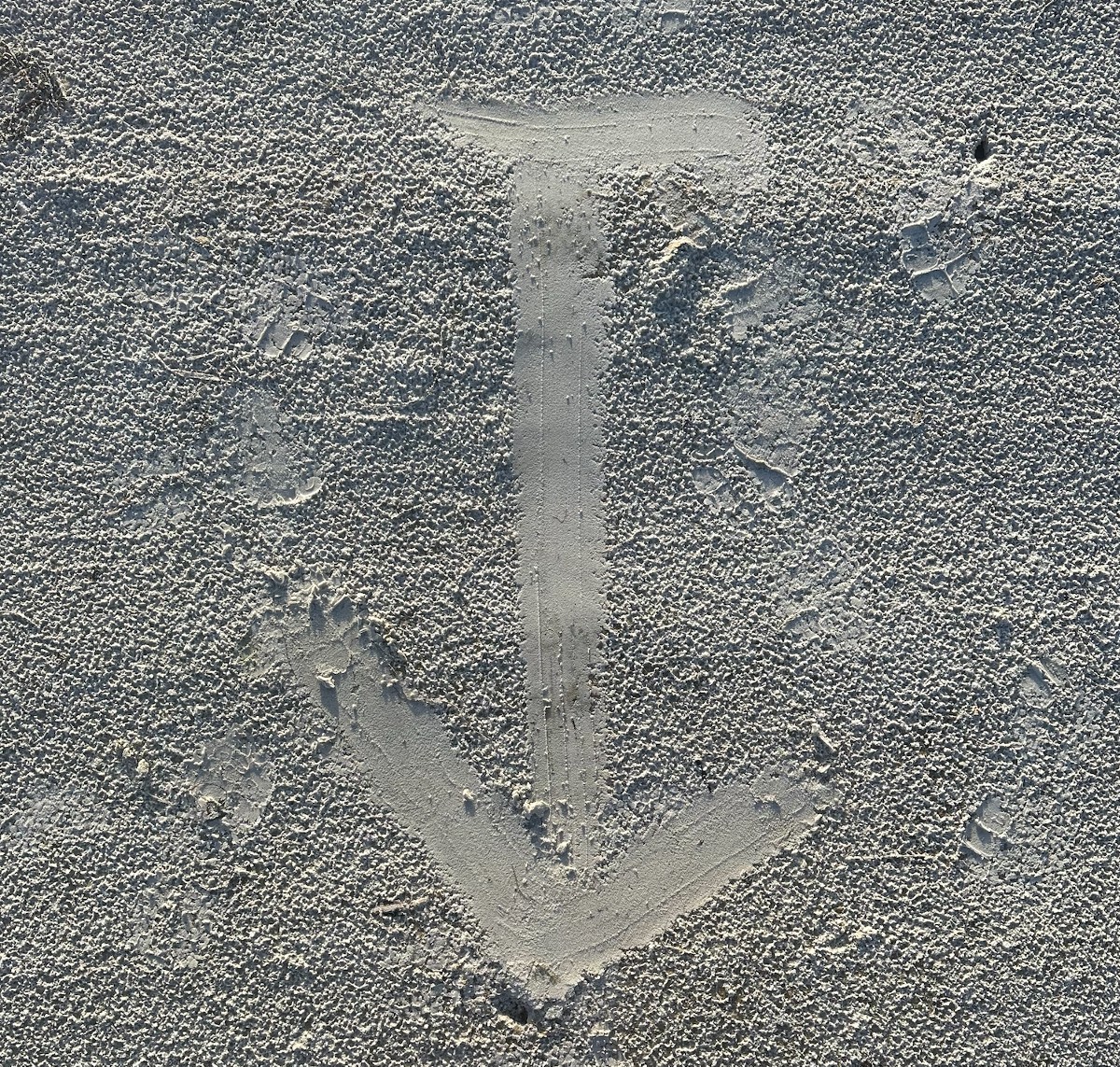 A simple sign in sand can provide direction